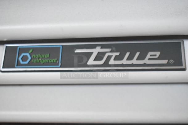 2021 True TSCI-600R-G-PH cooler badge, showing brand logo and "natural refrigerant" label.