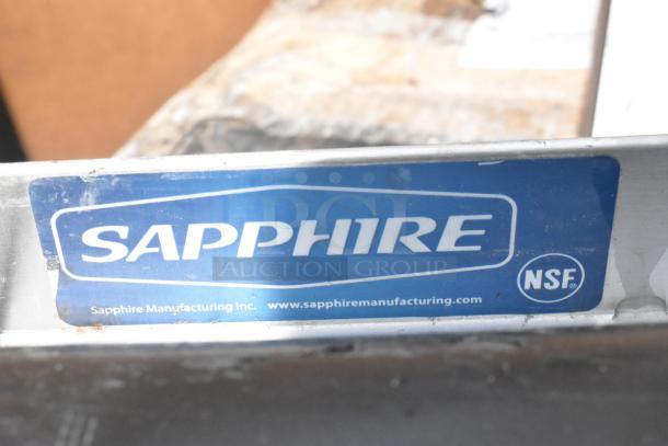 Sapphire Manufacturing label on metal surface, indicating NSF certification.