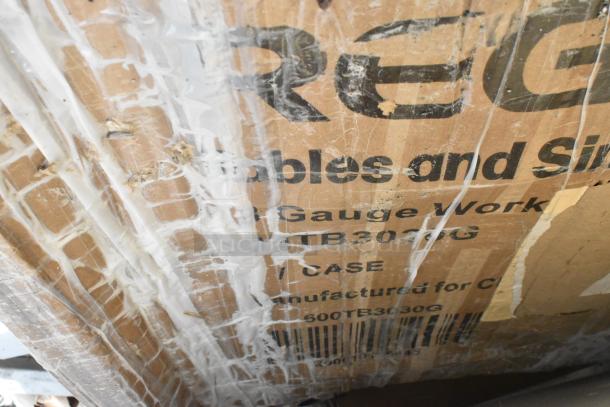 Cardboard box labeled with "Regency," showing wear and old tape. Contains various auction items, including a Regency 64" NSF epoxy shelving post.