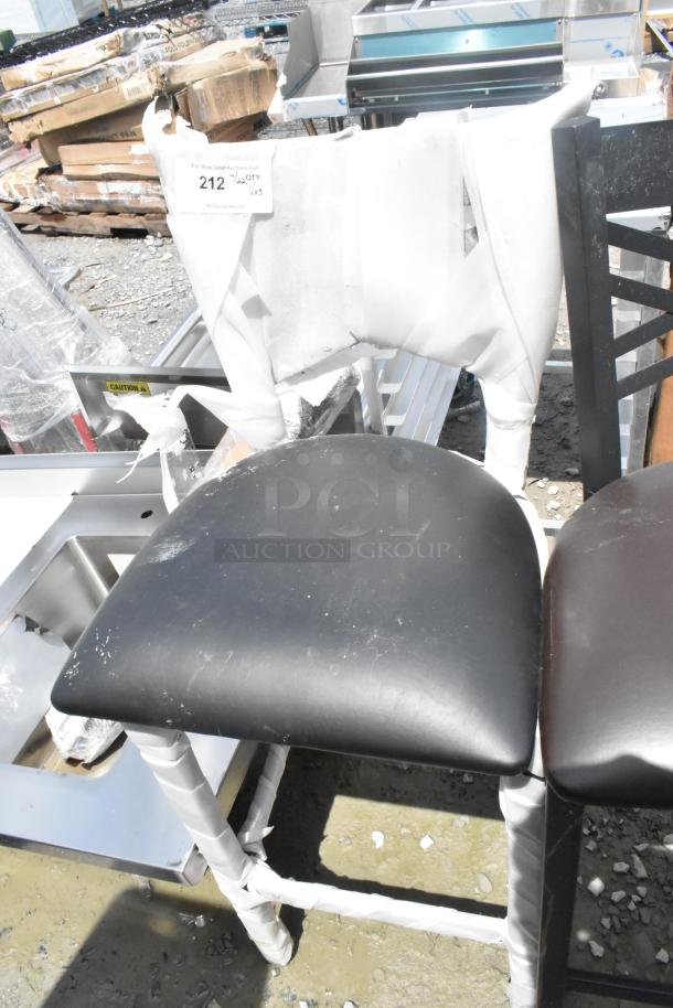 Three brand new bar height chairs with black seats and protective wrapping. Tags indicate "3x your bid" auction.