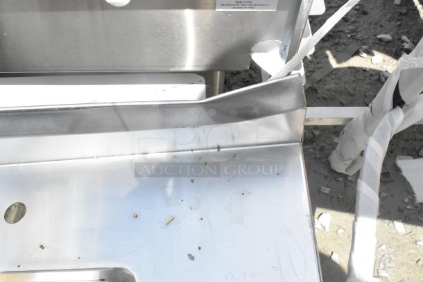 Brand new Regency 600ST3096R stainless steel tabletop with right-side sink, scratches and dents, no legs, 16-gauge steel.