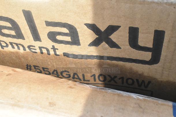 Cardboard box labeled "Galaxy Equipment #554GAL10X10W." Contains a white 10' x 10' pop-up canopy tent.