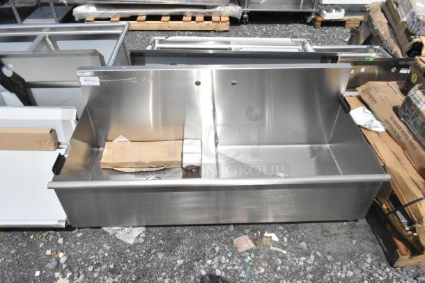 BRAND NEW Regency 600S23024SB 30"x24"x14" stainless steel two-compartment utility sink, no legs, slight scratches visible.