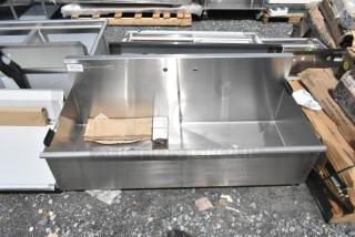 BRAND NEW Regency 600S23024SB 30"x24"x14" stainless steel two-compartment utility sink, no legs, slight scratches visible.
