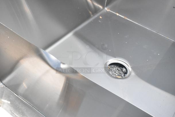 Brand new Regency 600S23024SB 30"x24"x14" two-compartment utility sink, no legs, visible dents, stainless steel finish.