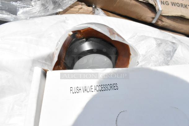 Brand new scratch and dent toilet, no tank. Includes flush valve accessories. Packaging visible.