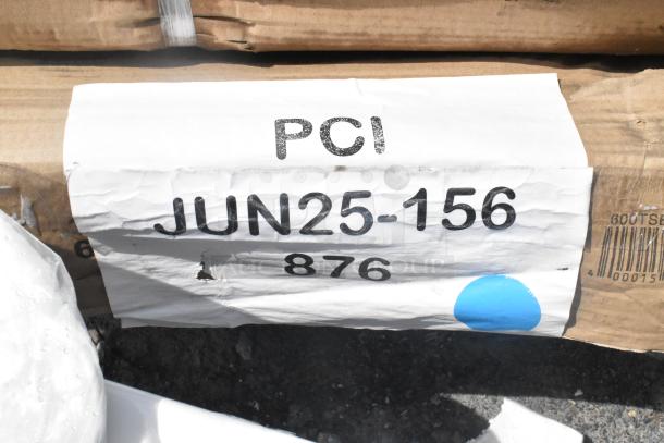Label on cardboard box showing "PCI JUN25-156 876" with a blue sticker, related to auction lot of scratch and dent items.