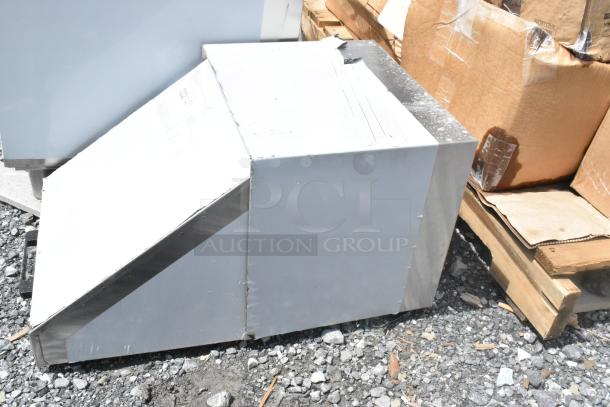 Brand new stainless steel mega top lid with visible scratches and dents, durable design, ideal for commercial use.