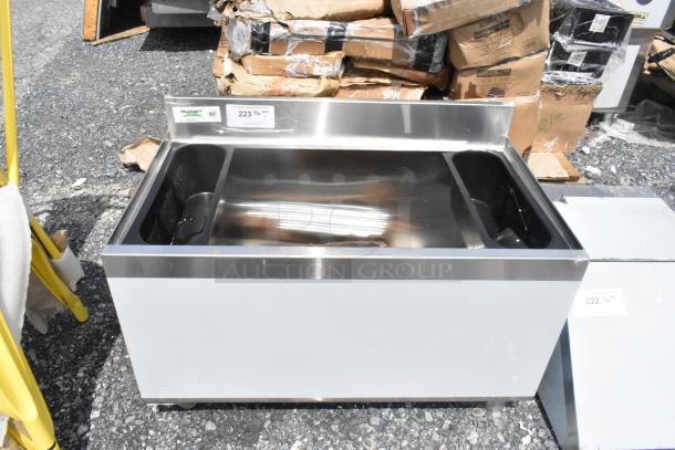Brand new Regency 600IB1830 18" x 30" underbar ice bin, 98 lb capacity, scratch and dent condition. NSF certified tag visible.