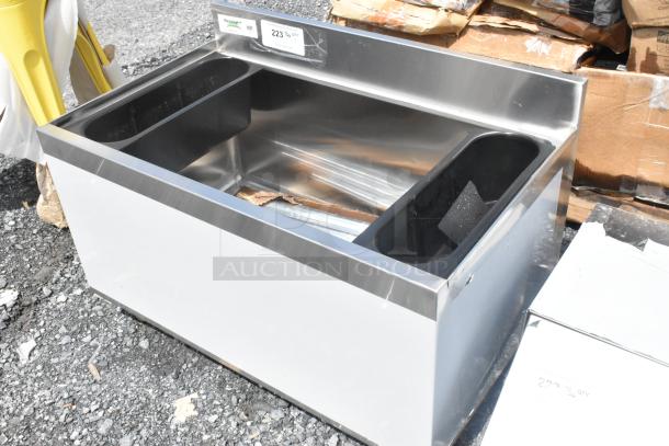 Brand new Regency 600IB1830 18" x 30" underbar ice bin, 98 lb capacity. Minor scratches and dents visible.