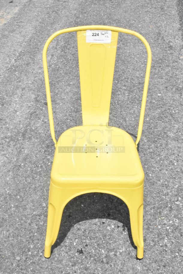 Yellow metal Tolix-style chair, brand new with minor scratches and dents, auctioned at two times your bid. Tag reads "224."