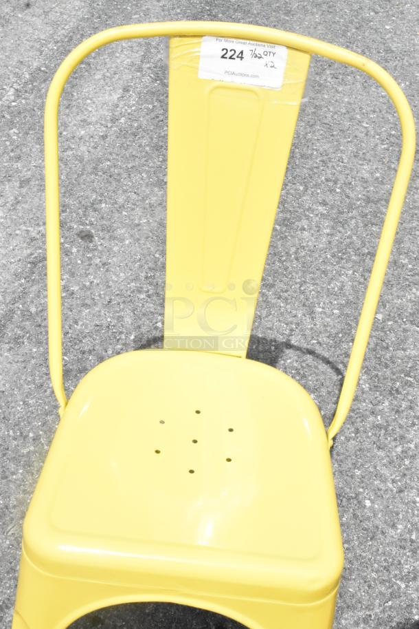 Yellow Metal Tolix Style Chair, brand new with scratch and dent, auction lot 224, perforated seat, 2 chairs available.