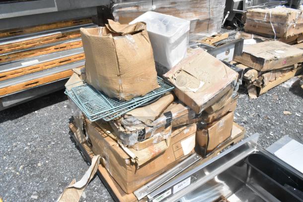 Brand new scratch and dent items on pallets, including trays, organizers, platters. Boxes damaged; items appear unused.