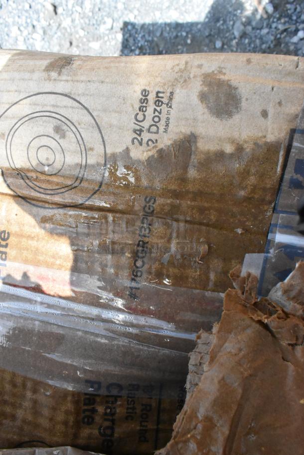 Cardboard box with water stains visible, marked "24/Case 2 Dozen Made in China." Contains trays, organizer, platters, schooner.