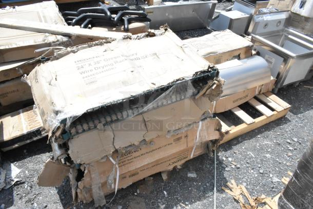 Seven new scratch and dent items including seat cushions, stainless tables, racks. Boxes show damage. Regency brand visible.