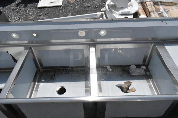 Brand new Regency 600S3242424R stainless steel 3-bay sink with right-side drain board, no legs, scratch and dent condition.