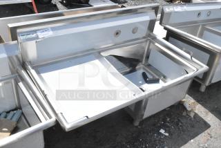 BRAND NEW Regency 600S1232324L stainless steel single bay sink with left side drain board, no legs, scratch and dent condition.