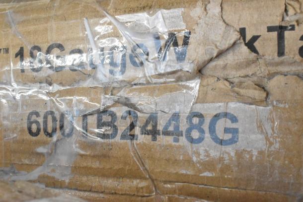 Close-up of damaged cardboard with "18GaugeW, 600TB2448G" text visible. Part of an auction lot including scratch and dent items.