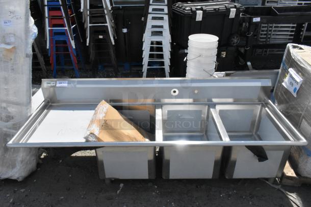 Brand new Regency 3 bay stainless steel sink, model 600S3182424L, with left side drainboard. Scratch and dent condition.