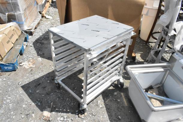 BRAND NEW Regency 600UPR8WTELS 8 Pan Aluminum Pan Rack with Stainless Steel Top, minor scratches and dents visible.