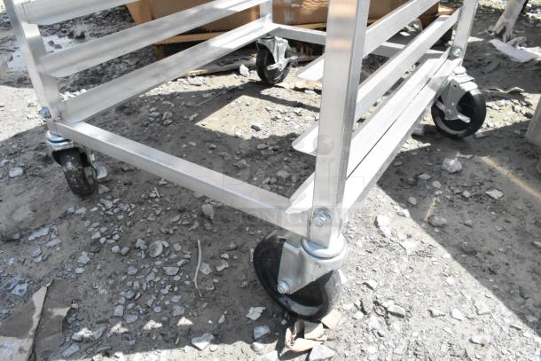 Regency 600UPR8WTELS aluminum pan rack, stainless steel top, side channel, scratch and dent condition, 8-pan capacity.