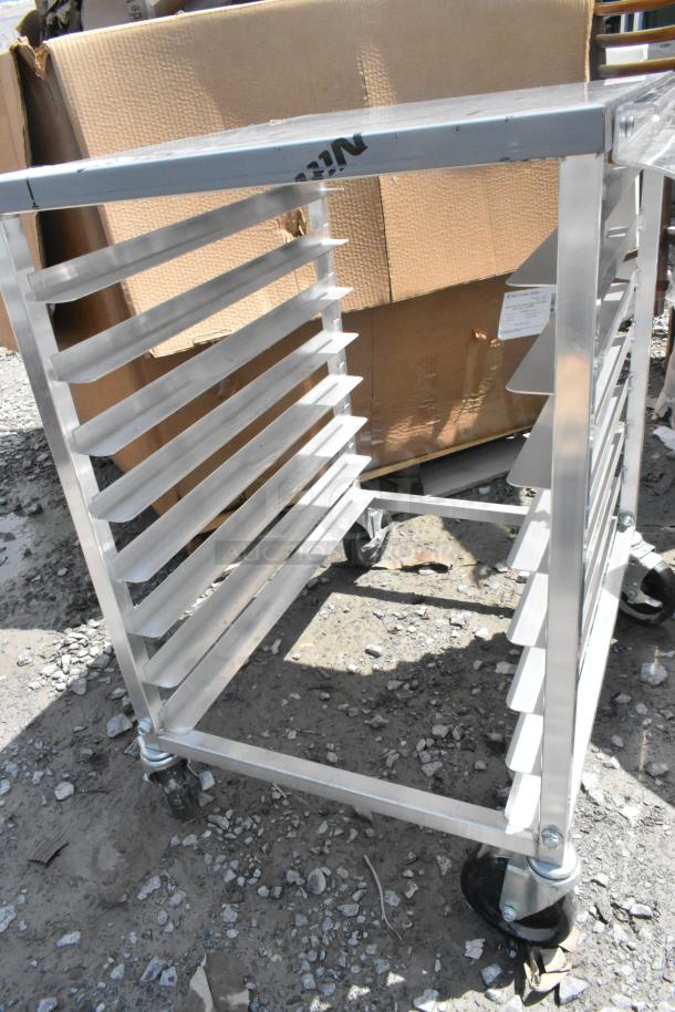 Brand new Regency 600UPR8WTELS aluminum undercounter bun rack, slight scratches, stainless steel top, side channels.