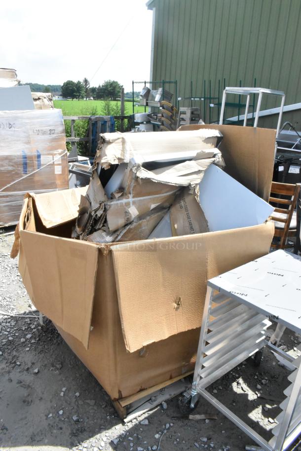 12 brand new items, scratch and dent condition, including stainless table, Metro shelves, and metal table. Box damaged.