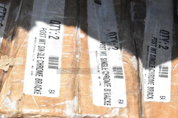 Labels reading “QTY: 2 POST MT SINGLE CHROME BRACKET” on cardboard packaging, part of scratch and dent auction items.