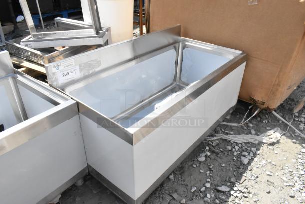 Brand new Steelton 522UIB1836 18"x36" underbar ice bin with bottle holders, 119 lb capacity, no legs, visible scratches and dents.