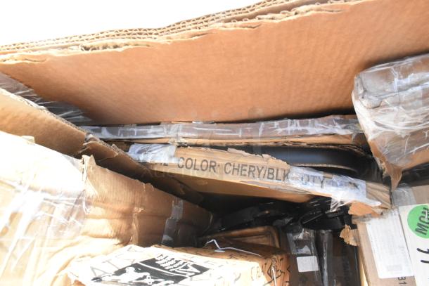 20 new scratch and dent items in boxes, including a stainless steel table and platform truck. Labels show "Color: Cherry/Blk" and quantity details.