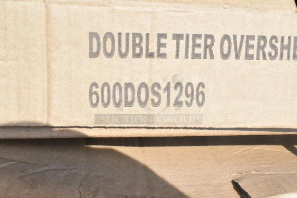 Cardboard box labeled "DOUBLE TIER OVERSHELF" with model number 600DOS1296, part of scratch and dent auction items.