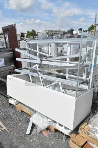 Brand new Avantco 193BCFD72W bakery display case with LED lighting. Visible broken glass, 120V, 1 phase, in white.