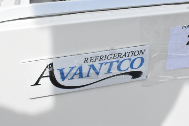 Alt text: Avantco logo on a 193BCFD72W white square bakery display case, featuring LED lighting. Scratch and dent condition with broken glass.