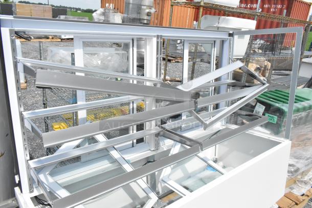 Brand new Avantco 193BCFD72W white bakery display case, 70 7/8", with LED lighting. Note: broken glass visible. 120V, 1 phase.