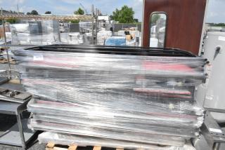 Pallet of round table trolley parts, wrapped in plastic, in used condition. Ideal for bulk purchase. Lot number 252 visible.
