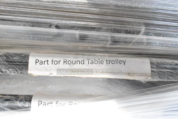 Lot of round table trolley parts on a pallet wrapped in plastic, labeled "Part for Round Table trolley."