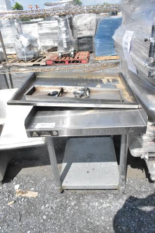 Stainless steel equipment stand with metal under shelf, Aero brand, NSF certified, used condition with visible wear.