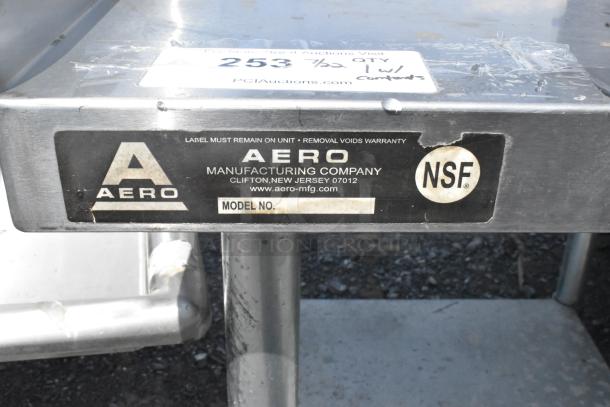 Stainless steel equipment stand with metal under shelf, made by Aero Manufacturing Company. Features NSF certification and model label.