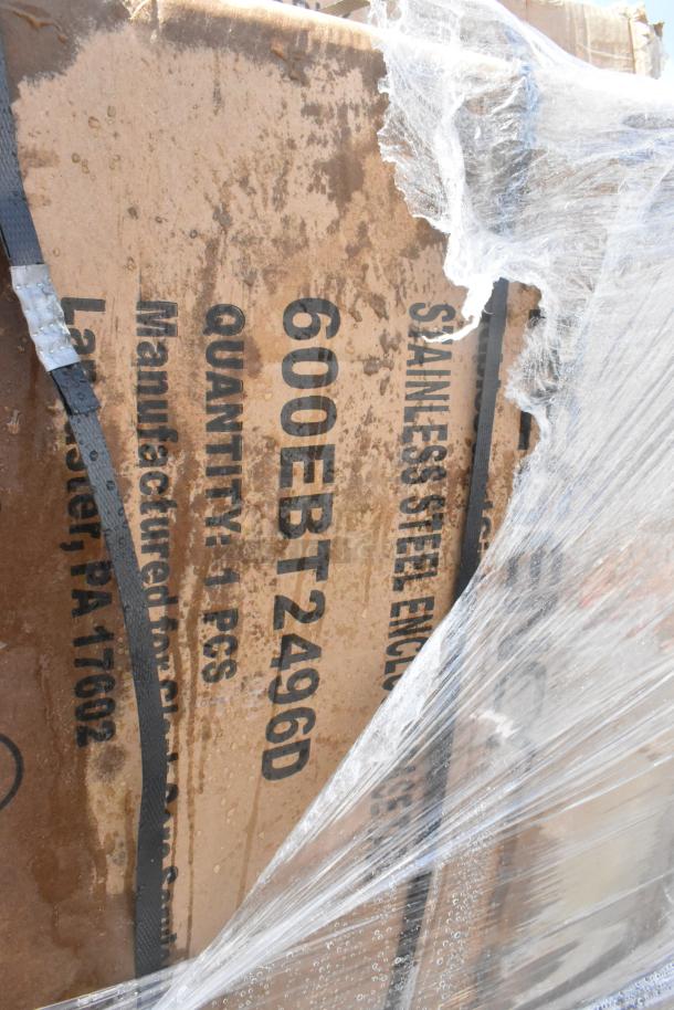 Cardboard box with text "600EBT2496D," indicating contents include stainless steel items. Box is wrapped in plastic.