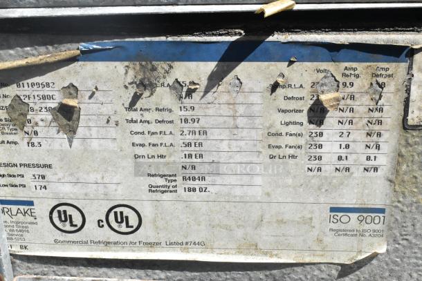 Norlake SELF CONTAINED Walk In Freezer label showing ISO 9001 certification, Norlake and UL markings, and voltage specifications.