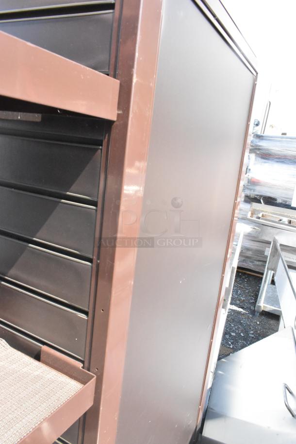 Brown metal shelving unit with sturdy frame, multiple shelves, and smooth finish. In good condition, ideal for storage.