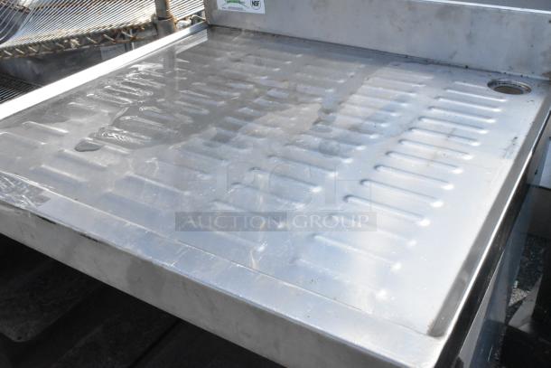 Regency 600GRSU2324C stainless steel drain board with under shelf, grooves for drainage, NSF-certified. Excellent condition.