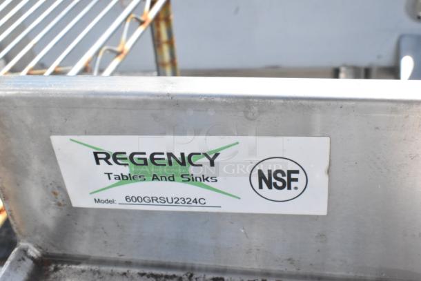 Regency 600GRSU2324C stainless steel commercial drain board with under shelf, NSF certified label visible.