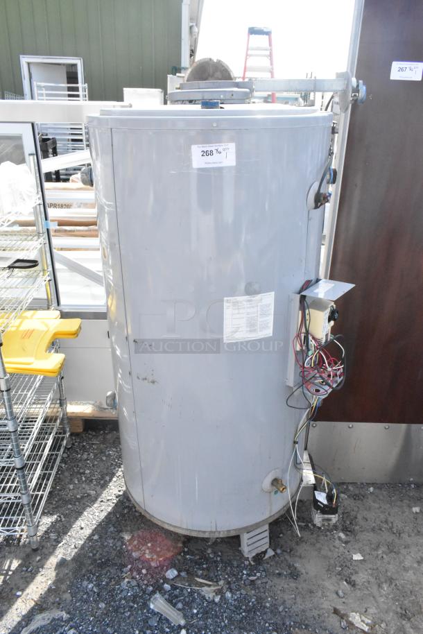 AO Smith BTR-120118 metal natural gas water heater, 120,000 BTU, visible wiring, needs maintenance, auction tag attached.