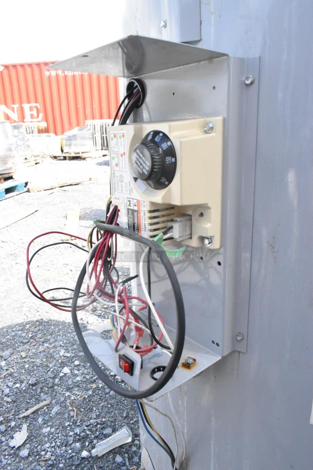 AO Smith BTR-120118 natural gas water heater, 120,000 BTU, metal exterior, visible wiring and control panel adjustments.