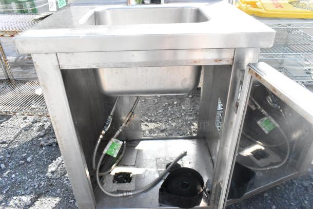 CustomCool Stainless Steel Single Bay Sink with faucet and handles, visible fittings and open cabinet. Used condition.