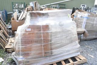 A wrapped pallet of 10 new scratch and dent items, including stainless tables, sneeze guard, tabletops, and chair seats.