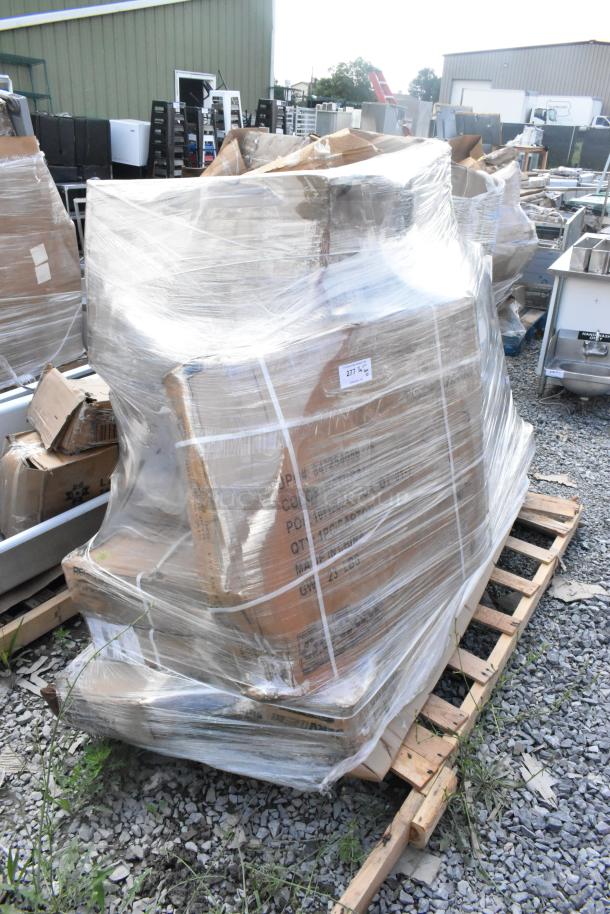 Plastic-wrapped pallet with boxes labeled "277 Qty," containing stainless tables, sneeze guard, tabletops, and chair seats.