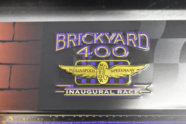Brickyard 400 Inaugural 1994 figurine box, features purple and gold Indianapolis Motor Speedway logo.