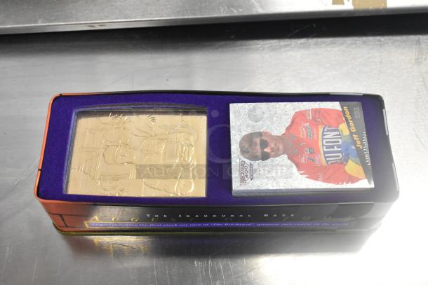IN ORIGINAL BOX! Brickyard 400 1994 Inaugural Race figurine, featuring Jeff Gordon, purple packaging, mint condition.
